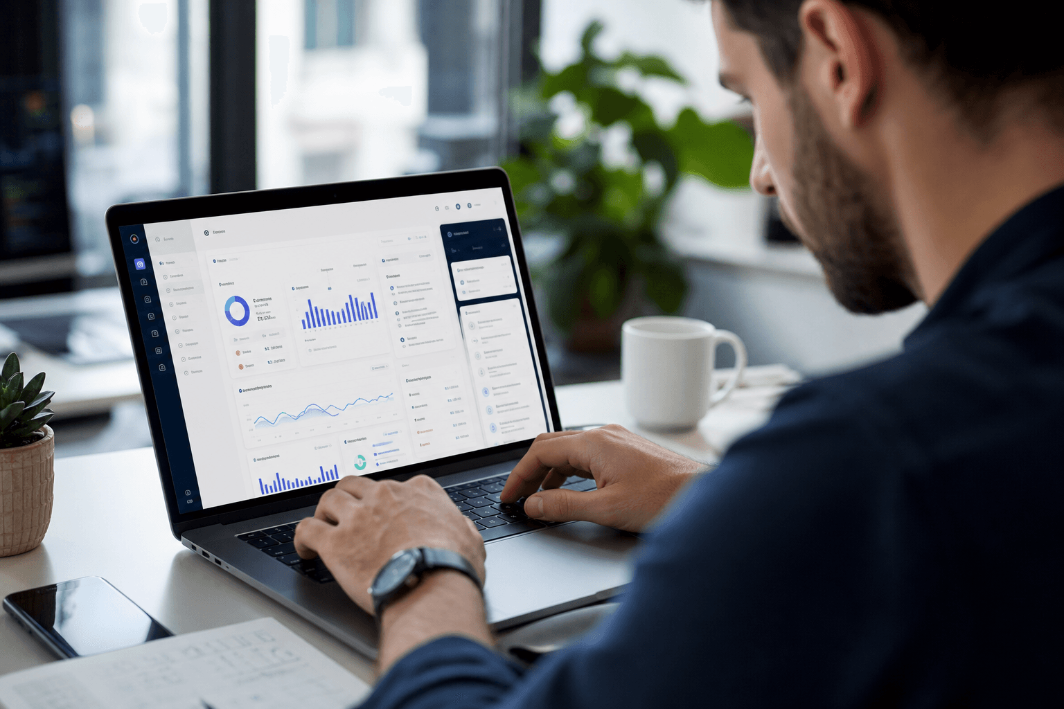 Developer hands on laptop building a modern app UI with clean product design visible on screen
